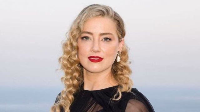 Amber Heard presents her twins with a touch of mystery
