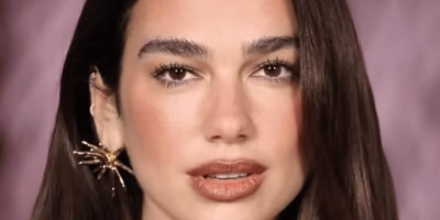 Dua Lipa shines in yellow at Chanel debut
